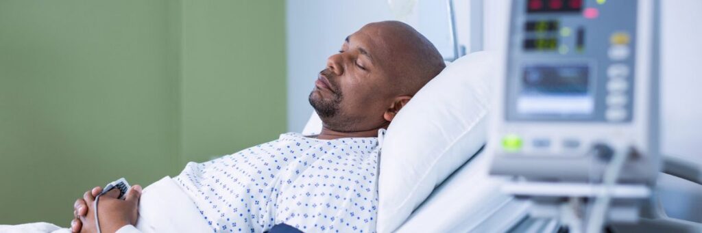 Three Months Ago, I Had Robotic Surgery to Remove My Prostate_Man in Hospital Bed